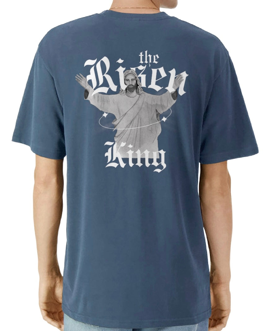 Navy blue t-shirt with graphic design on the back featuring a figure and 'The Risen King' text.