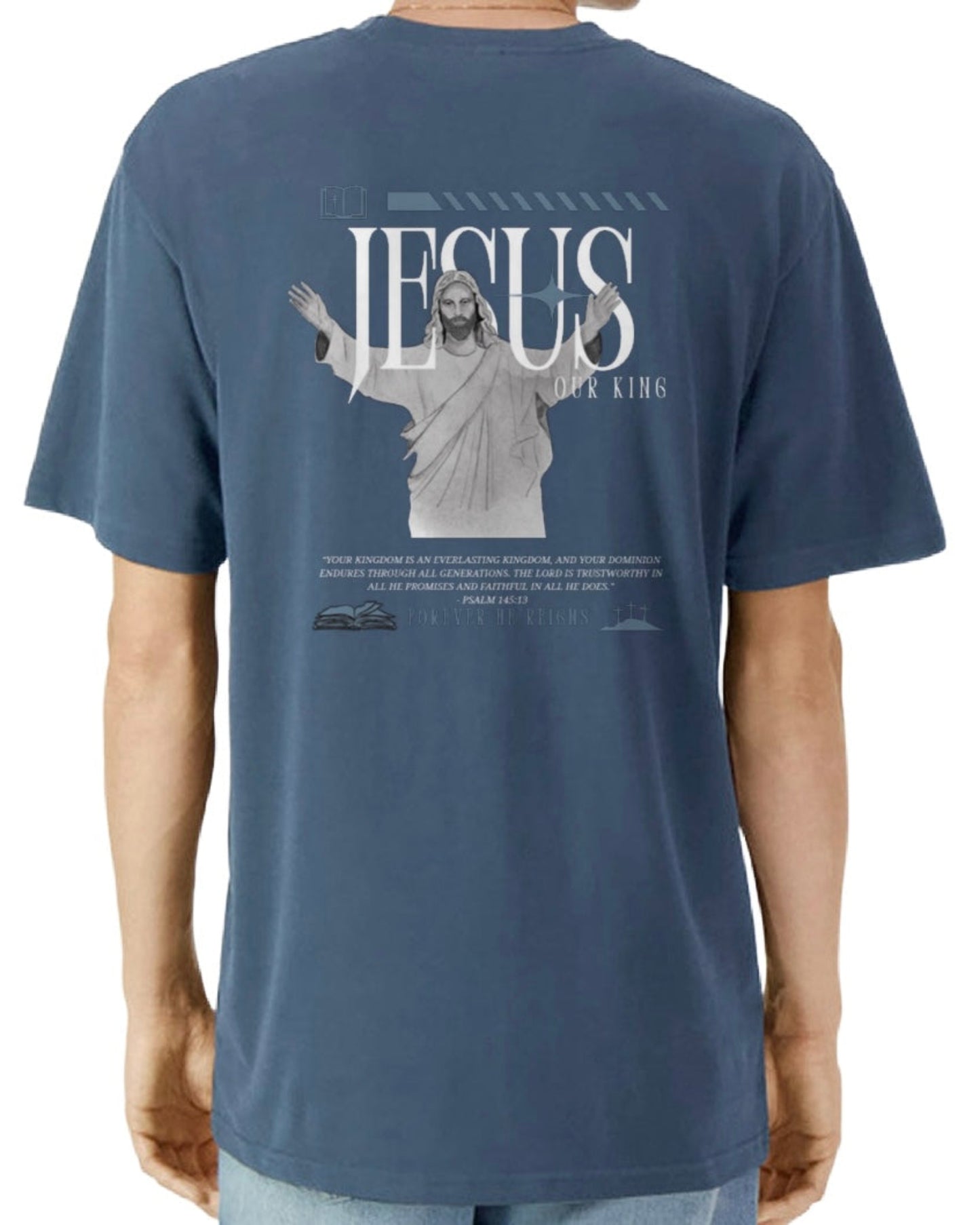 Blue t-shirt with a graphic of Jesus on the back, 'Jesus Our King', displayed on a person.