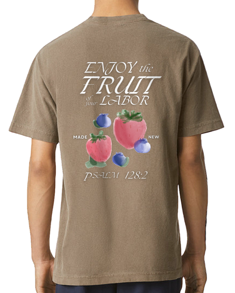 Person wearing a brown t-shirt with fruit graphic and text on the back