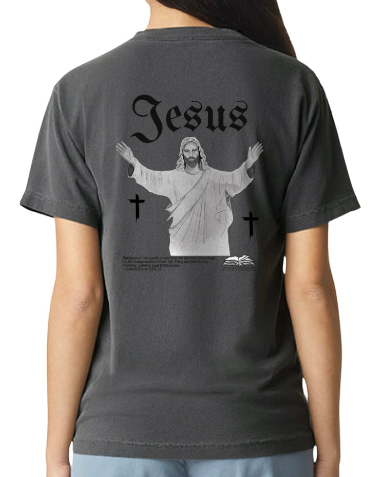 Person wearing a dark gray t-shirt with a graphic of Jesus on the back