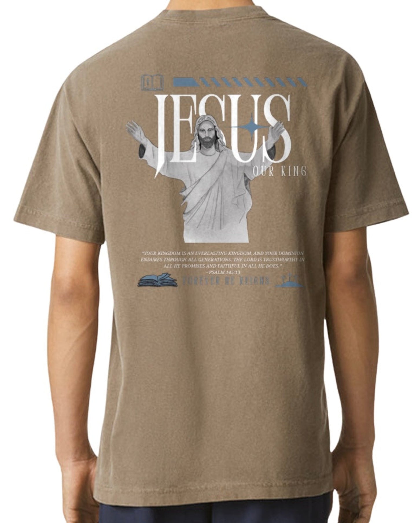 Brown t-shirt with a graphic of Jesus on the back, 'Jesus Our King',  displayed on a person.